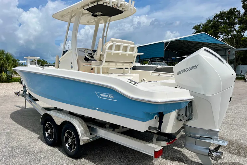 Slide: The Image of 2026 Boston Whaler 220 Dauntless boat with Mercury engine on trailer. - 6