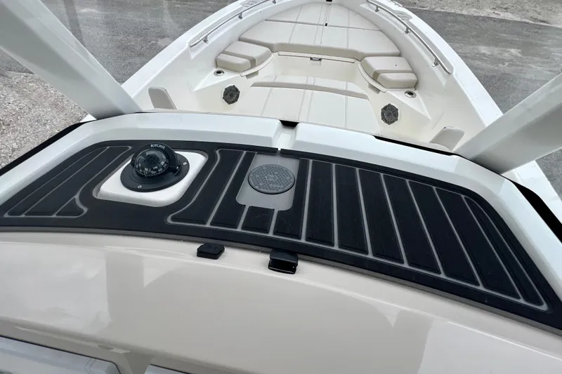 Slide: The Image of Boston Whaler 250 Dauntless 2026 with compass and deck view. - 20