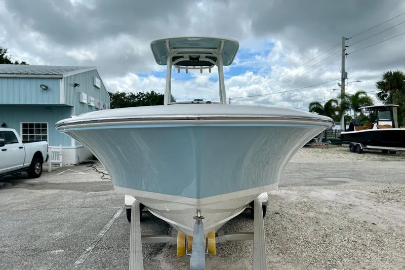 Slide: The Image of 2026 Boston Whaler 250 Dauntless boat on a trailer. - 3