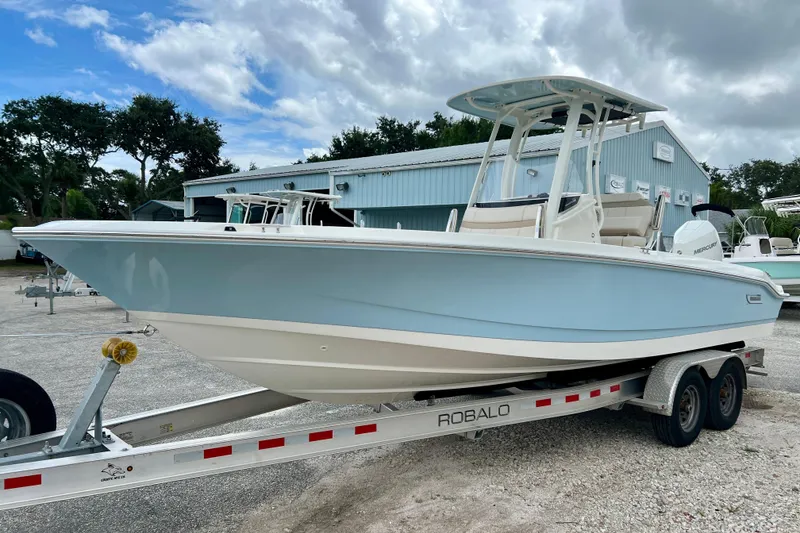Slide: The Image of Boston Whaler 250 Dauntless 2026 on a trailer outdoors. - 4