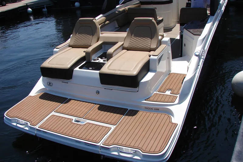 Slide: The Image of 2018 Sea Ray SDX 290 boat with luxurious seating and teak-style decking. - 12