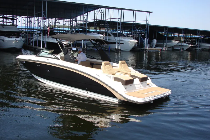 Slide: The Image of Simrad display on 2018 Sea Ray SDX 290 boat dashboard showing navigation and engine data. - 17