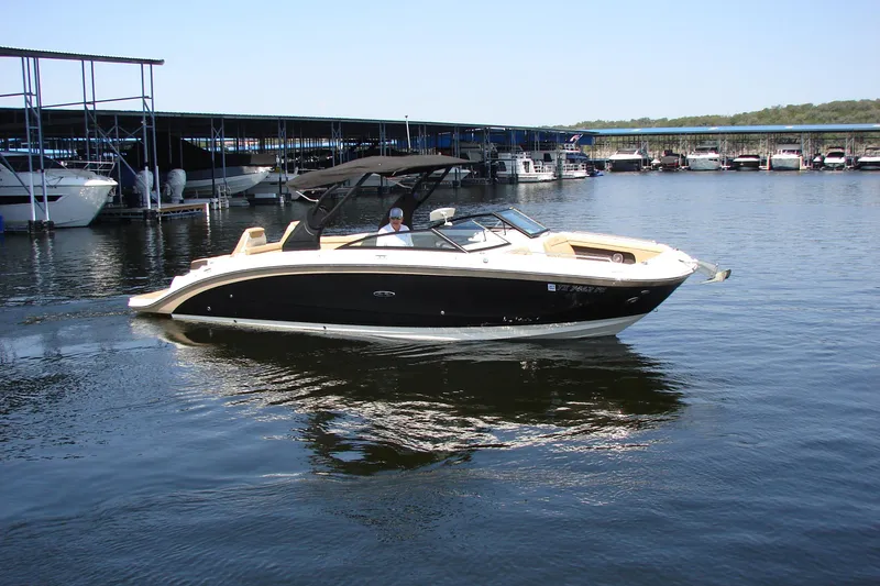 Slide: The Image of 2018 Sea Ray SDX 290 boat interior with steering wheel and control panel. - 22