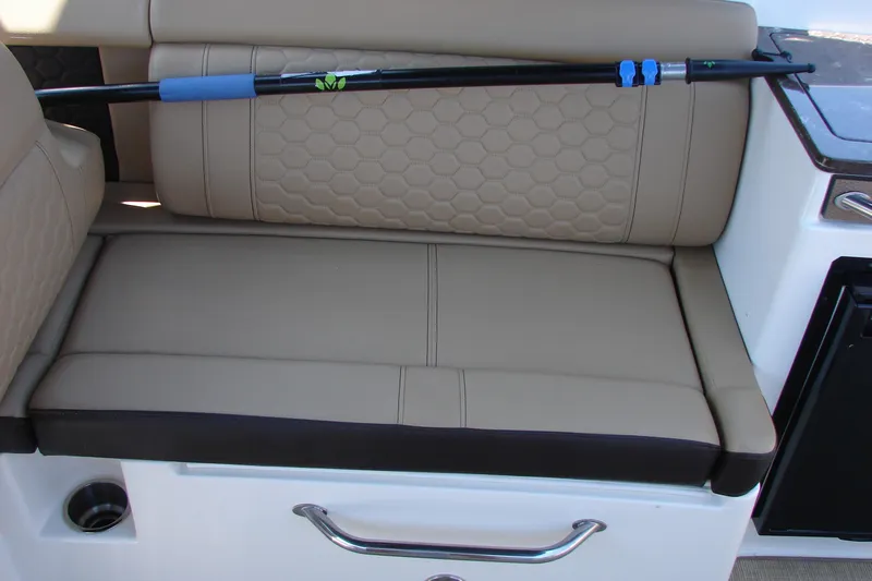 Slide: The Image of 2018 Sea Ray SDX 290 boat interior with countertop and storage area. - 29