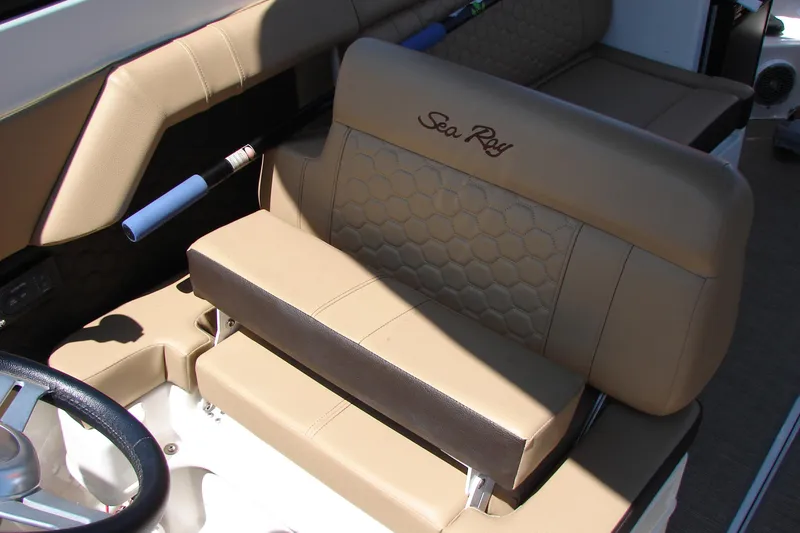 Slide: The Image of 2018 Sea Ray SDX 290 interior with beige seating and textured flooring. - 34