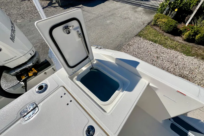 Slide: The Image of Boston Whaler 280 Dauntless 2026 with open storage compartment and engine view. - 11