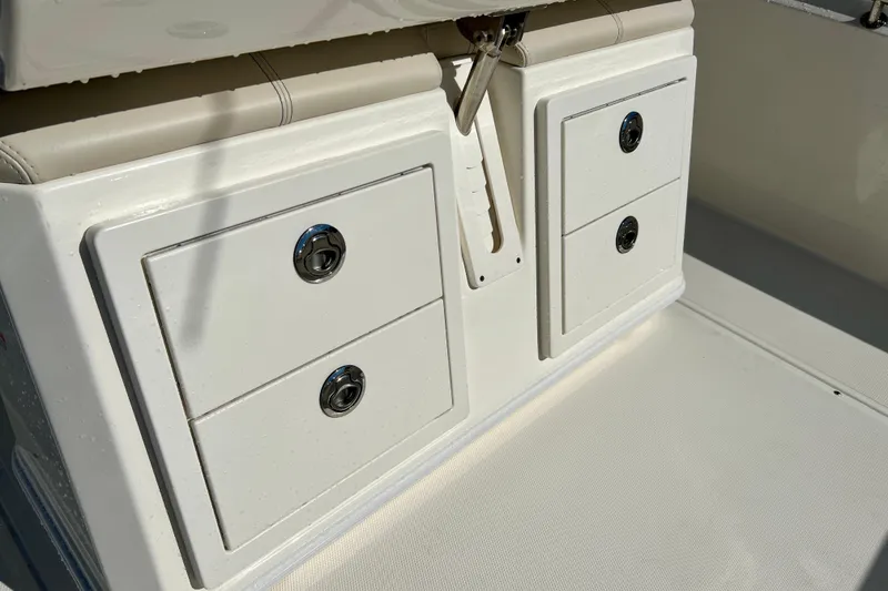 Slide: The Image of Storage compartment on a 2026 Boston Whaler 280 Dauntless boat. - 14