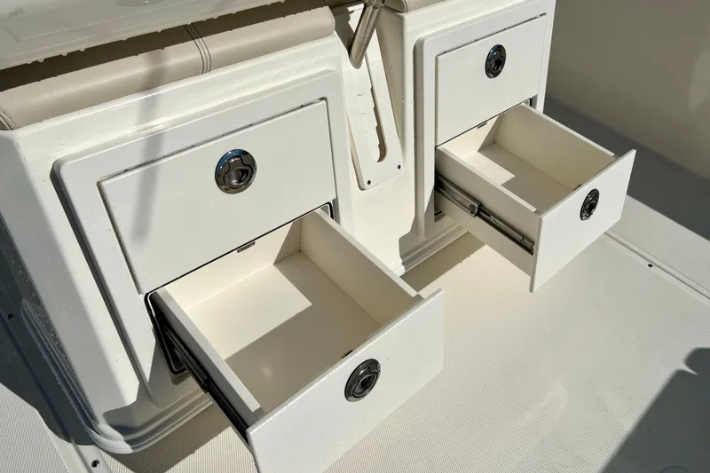 Slide: The Image of Boston Whaler 280 Dauntless 2026, open drawers on the boat. - 15
