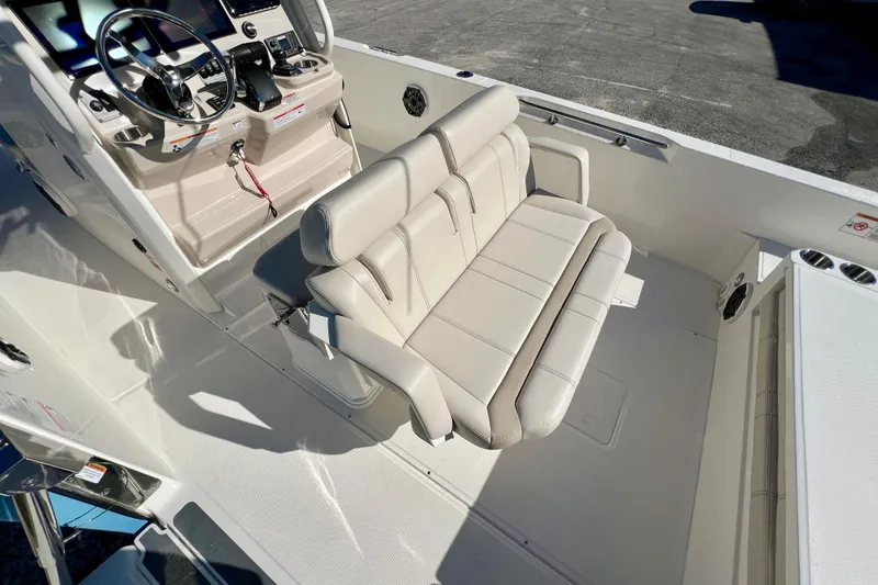Slide: The Image of Interior of 2026 Boston Whaler 280 Dauntless with helm and seating area. - 16