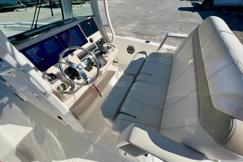 Slide: The Image of Interior of 2026 Boston Whaler 280 Dauntless with helm console. - 18