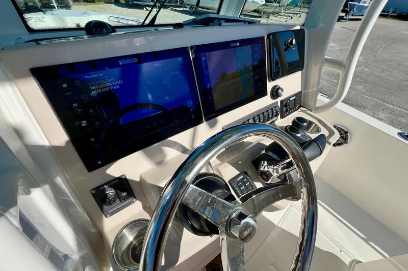Slide: The Image of Boston Whaler 280 Dauntless 2026 helm with modern displays. - 20
