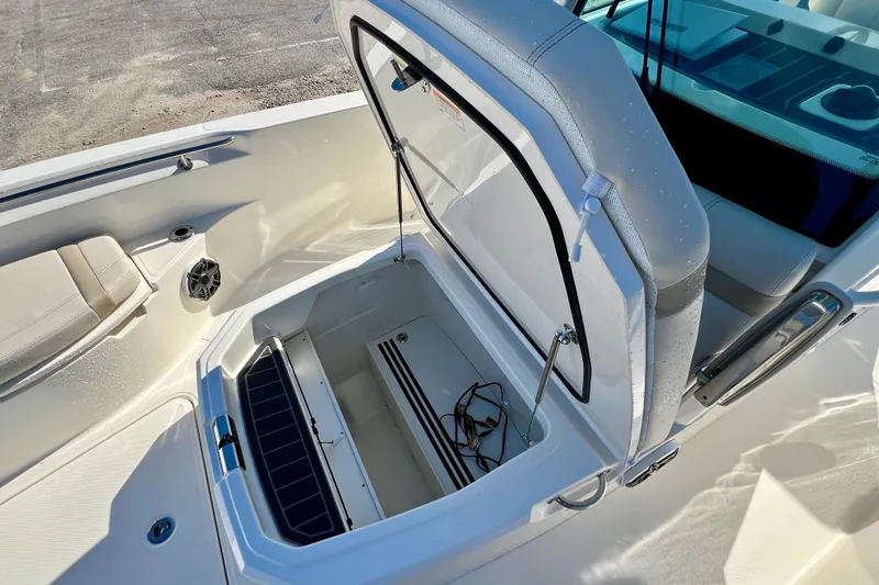 Slide: The Image of Boston Whaler 280 Dauntless 2026 with open storage compartment. - 27