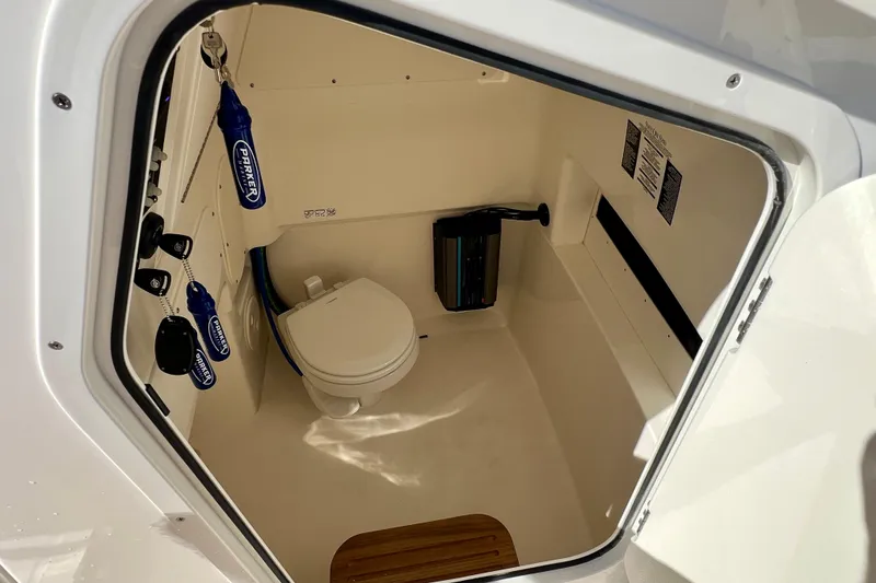 Slide: The Image of Interior of 2026 Boston Whaler 280 Dauntless featuring a toilet. - 32