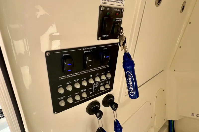 Slide: The Image of Control panel of Boston Whaler 280 Dauntless 2026 with switches and key. - 33