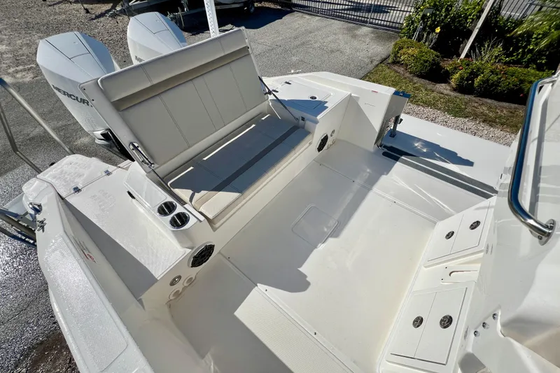 Slide: The Image of Interior of 2026 Boston Whaler 280 Dauntless with seating and engines. - 9