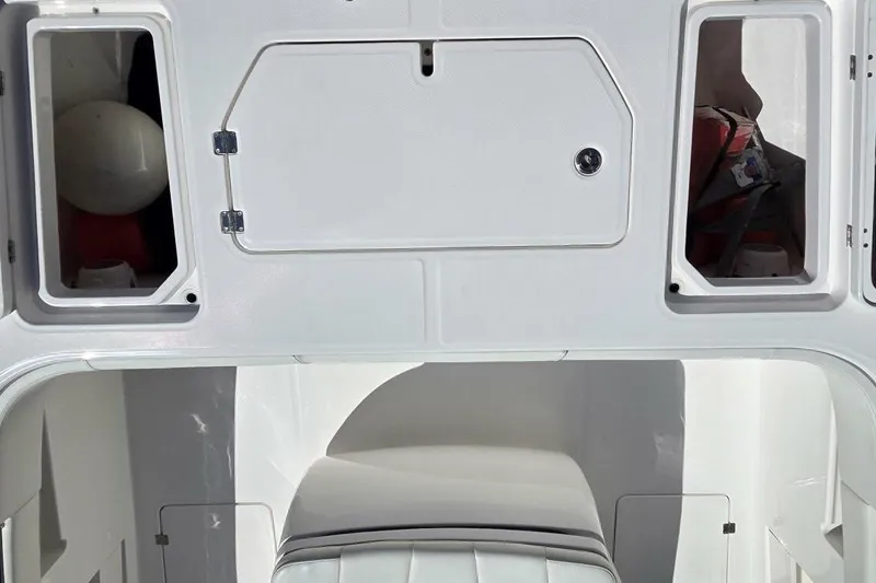 Slide: The Image of 2020 Invincible 35 Catamaran interior storage compartments and seating area. - 10