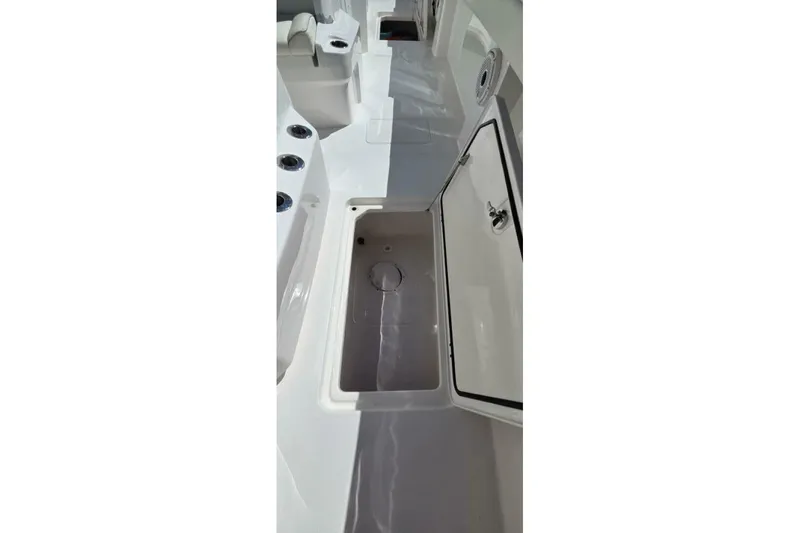 Slide: The Image of 2020 Invincible 35 Catamaran interior with open storage compartment. - 13