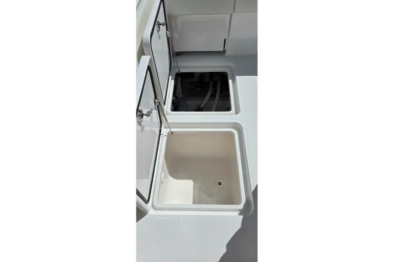 Slide: The Image of Open storage compartments on a 2020 Invincible 35 Catamaran boat deck. - 15