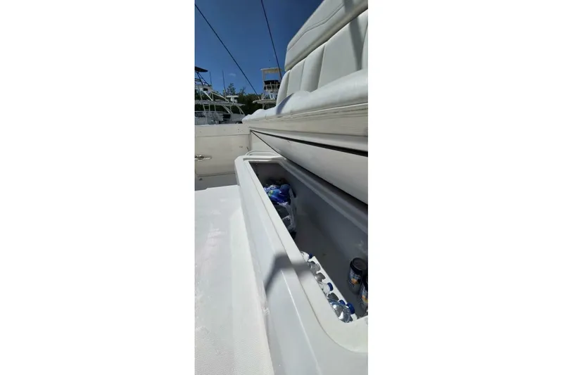 Slide: The Image of 2020 Invincible 35 Catamaran with open storage compartment, containing drinks and ice. - 30