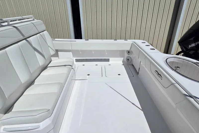 Slide: The Image of 2020 Invincible 35 Catamaran interior with white seating and fishing amenities. - 35