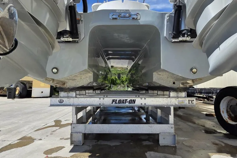 Slide: The Image of 2020 Invincible 35 Catamaran on trailer, showcasing hull design and outboard engines. - 41