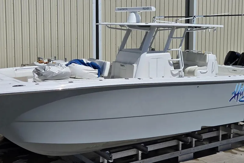 Slide: The Image of 2020 Invincible 35 Catamaran boat docked, featuring sleek design and modern equipment. - 44