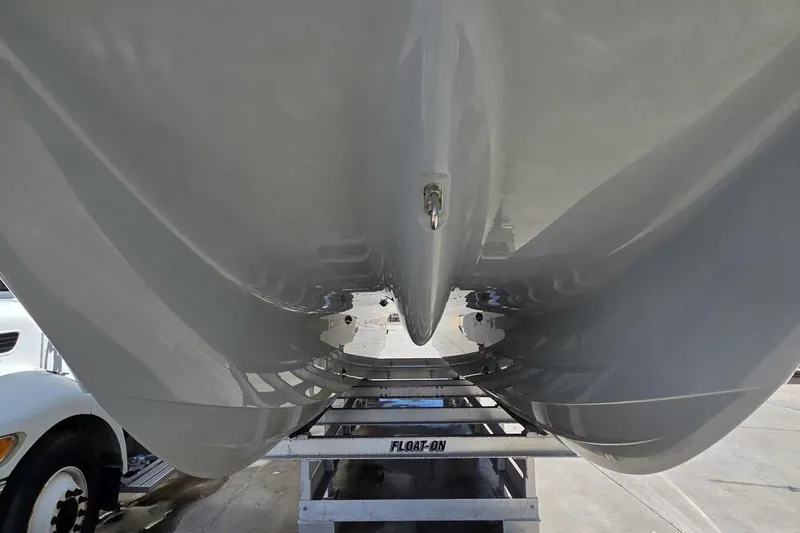 Slide: The Image of Underneath view of a 2020 Invincible 35 Catamaran on a trailer. - 46