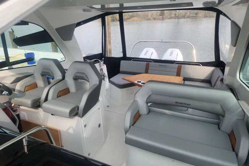 Slide: The Image of Interior of 2025 Beneteau Gran Turismo 32 yacht with modern seating and table. - 12