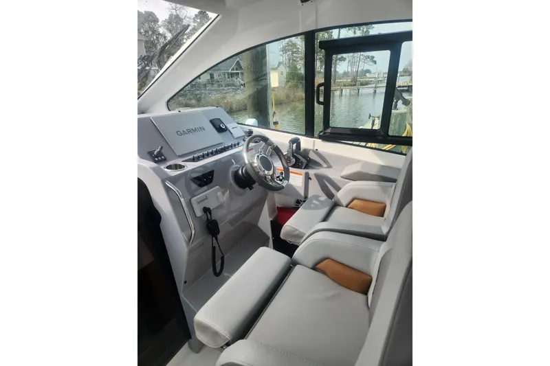 Slide: The Image of Interior cockpit of 2025 Beneteau Gran Turismo 32 with Garmin navigation system. - 14