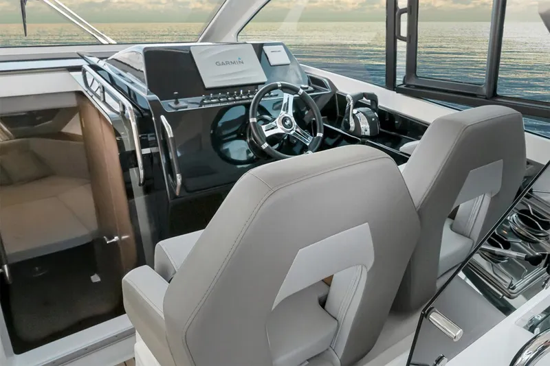 Slide: The Image of Manufacturer Provided Image: Interior of 2025 Beneteau Gran Turismo 32 with modern helm station. - 22