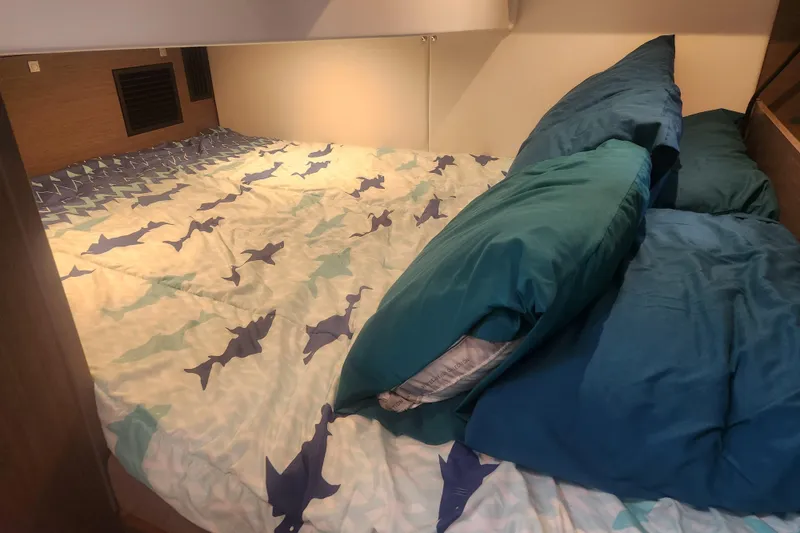 Slide: The Image of Cozy cabin bed with shark-themed bedding in 2025 Beneteau Gran Turismo 32 yacht. - 27