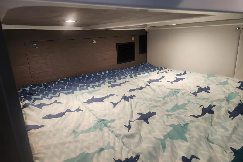 Slide: The Image of Cozy cabin bed with shark-patterned bedding in 2025 Beneteau Gran Turismo 32 yacht. - 28