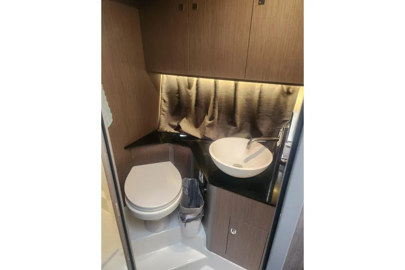 Slide: The Image of Compact bathroom in 2025 Beneteau Gran Turismo 32 yacht with modern sink and toilet. - 31