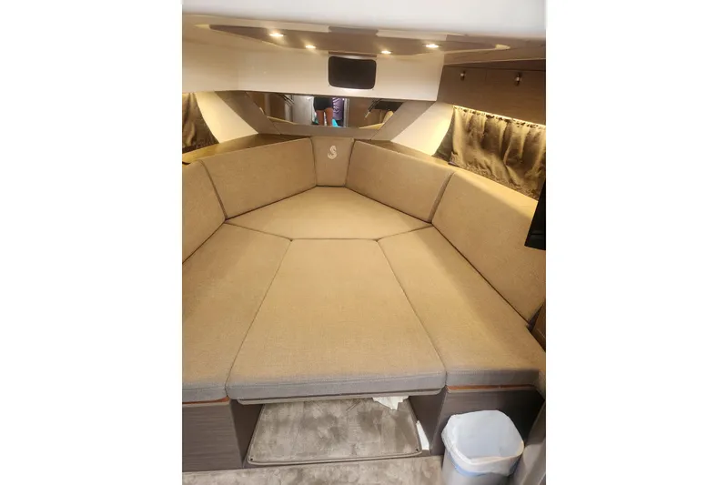 Slide: The Image of Interior cabin of 2025 Beneteau Gran Turismo 32 with beige seating and modern design. - 36