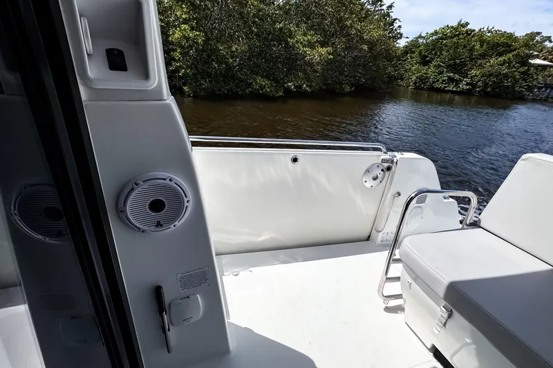 Slide: The Image of Beneteau Antares 11 boat deck with seating, speaker, and water view, 2023 model. - 10