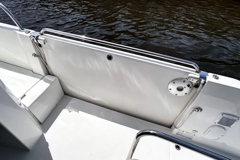 Slide: The Image of 2023 Beneteau Antares 11 boat deck with railing and water view. - 11
