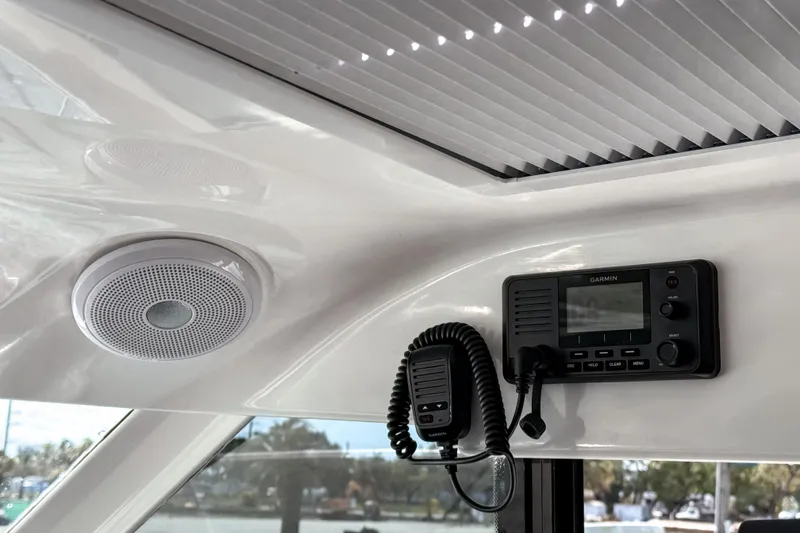 Slide: The Image of Interior of 2023 Beneteau Antares 11 with Garmin radio and speaker system. - 30