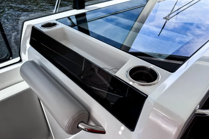 Slide: The Image of 2023 Beneteau Antares 11 dashboard with cup holders and sleek design. - 31