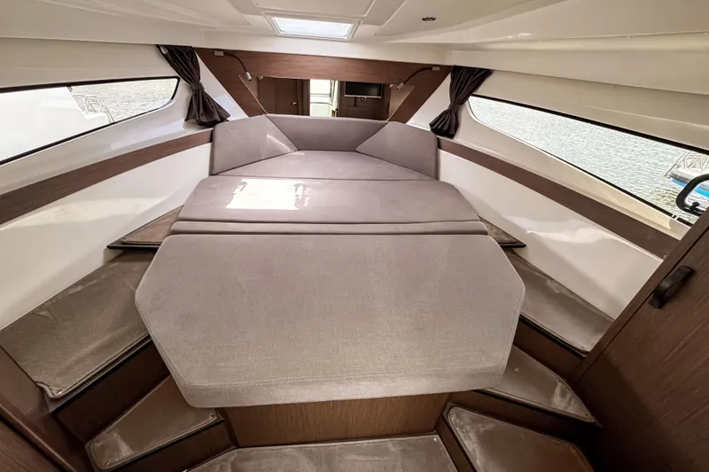 Slide: The Image of Interior cabin of 2023 Beneteau Antares 11 with comfortable seating and modern design. - 32