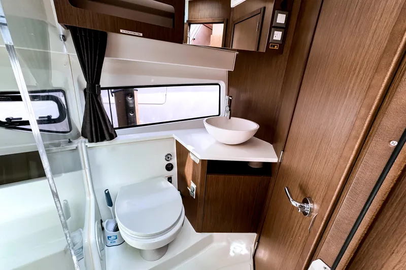 Slide: The Image of Modern bathroom interior of 2023 Beneteau Antares 11 yacht with sleek fixtures. - 34