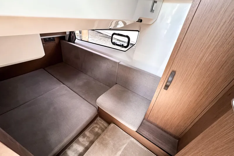 Slide: The Image of Interior cabin of 2023 Beneteau Antares 11 with cozy seating and wooden finishes. - 39