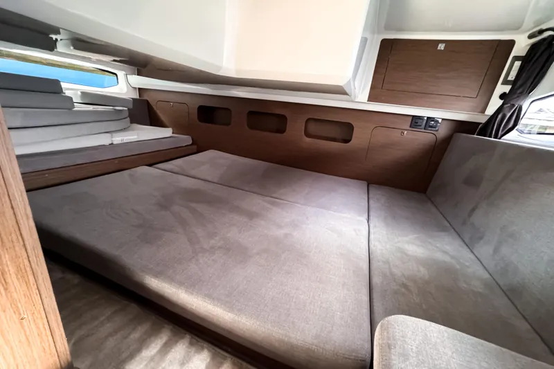 Slide: The Image of Interior cabin of 2023 Beneteau Antares 11 with cozy seating and wooden accents. - 41