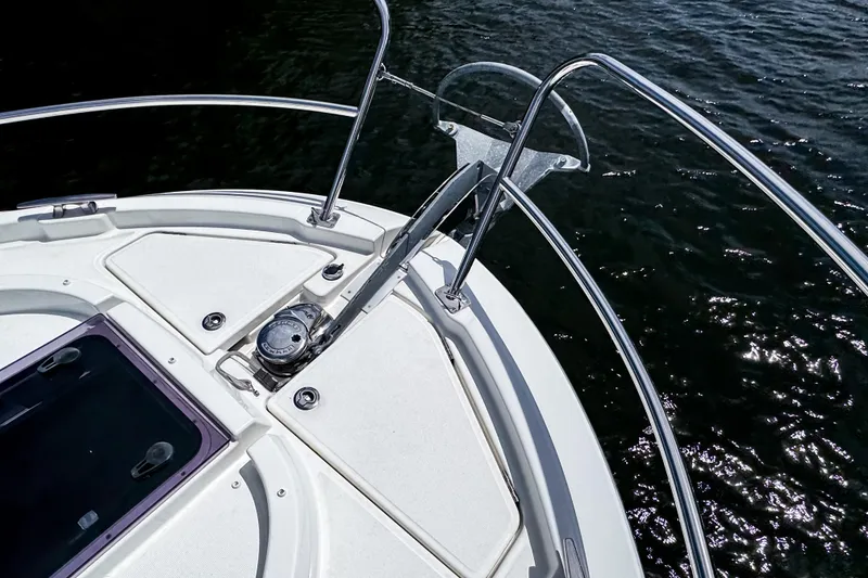 Slide: The Image of Bow of 2023 Beneteau Antares 11 with anchor and railing over water. - 46