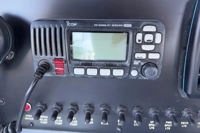 Slide: The Image of Control panel of 2024 Strike 26 Center Console Cuddy with VHF marine radio. - 13