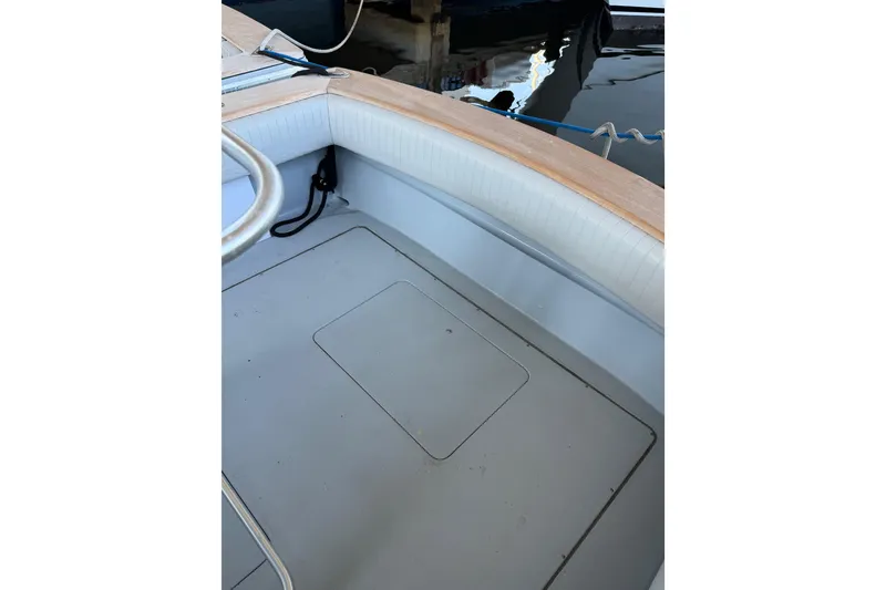 Slide: The Image of 2024 Strike 26 Center Console Cuddy boat interior with clean deck and seating. - 22
