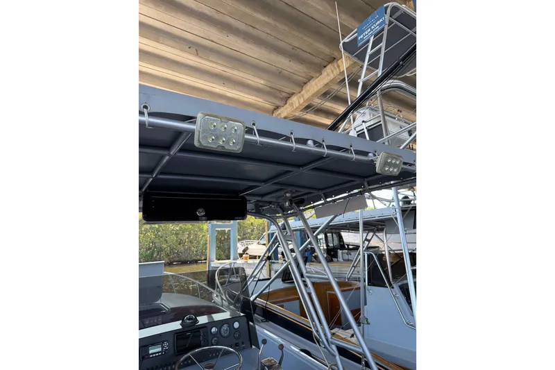 Slide: The Image of 2024 Strike 26 Center Console Cuddy boat interior with electronics and overhead lighting. - 6