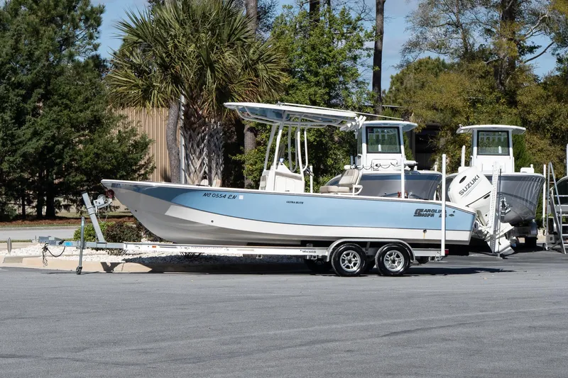 The Image of 2020 Carolina Skiff 24 Ultra Elite boat on trailer, parked outdoors. - 1