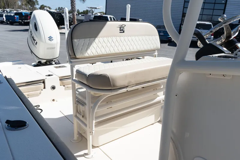 Slide: The Image of 2020 Carolina Skiff 24 Ultra Elite boat interior with seating and Suzuki engine. - 11