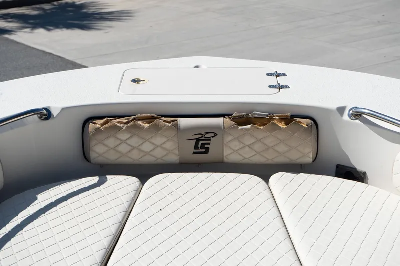 Slide: The Image of 2020 Carolina Skiff 24 Ultra Elite boat interior with quilted seating and storage compartment. - 13