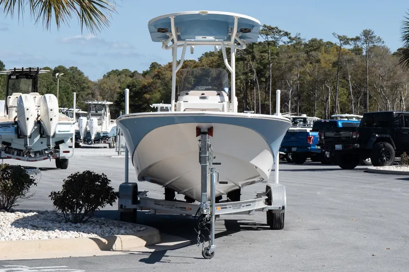 Slide: The Image of 2020 Carolina Skiff 24 Ultra Elite boat on trailer in parking lot. - 3